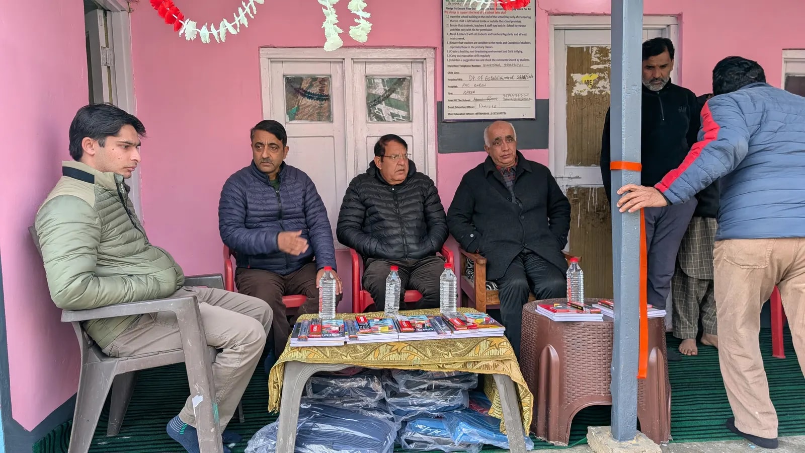 Guests seated beside the stationery kits and school bags