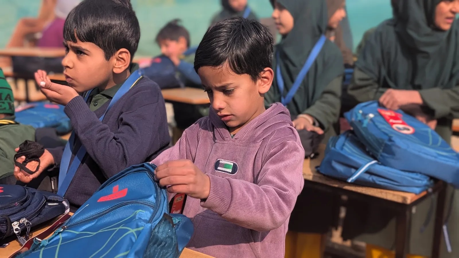Students exploring their new school bags
